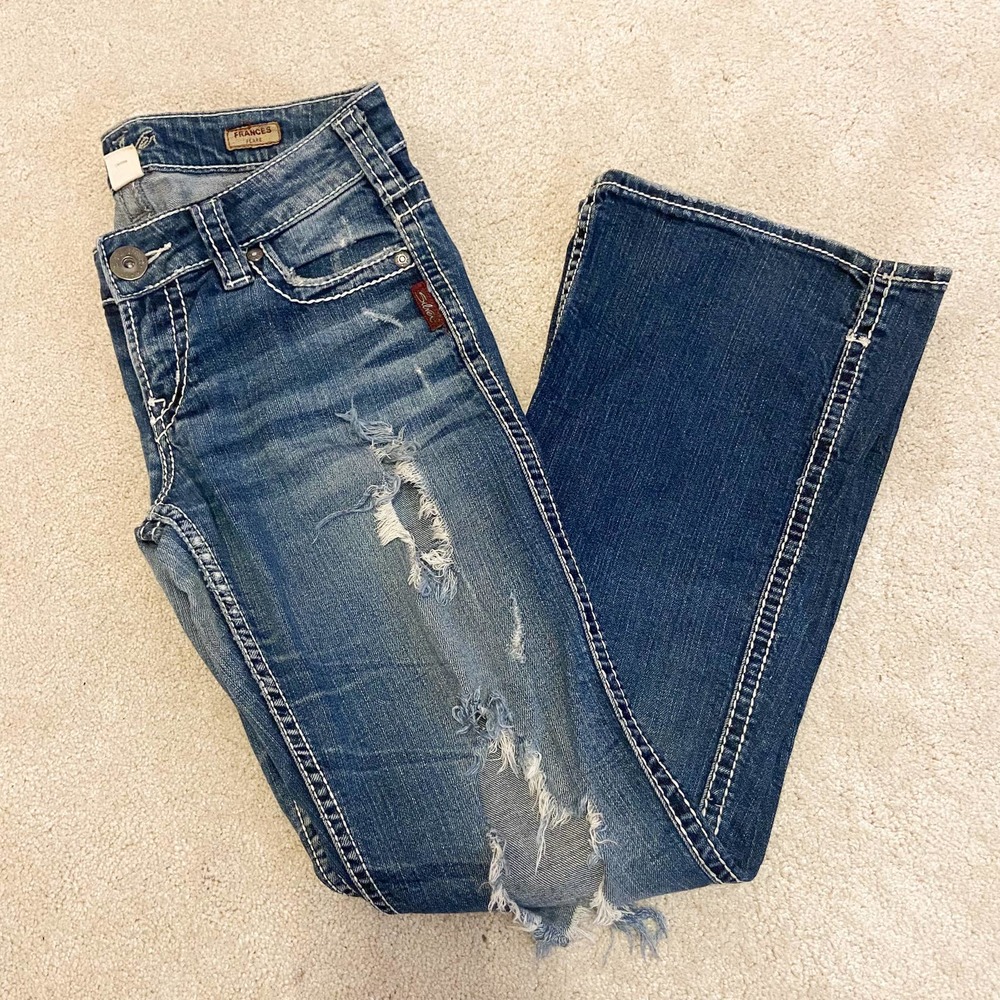 Silver Jeans, distressed jeans, flare bottom jeans, medium wash distressed jeans